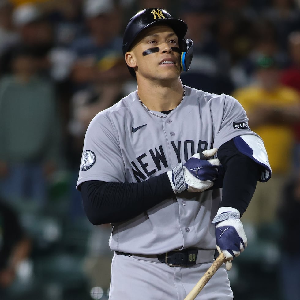 New York Yankees' Aaron Judge reacts after drawing a bases loaded walk to score a run during the ninth inning of a baseball game against the Athletics Saturday, May 30, 2026, in West Sacramento, Calif. (AP Photo/Scott Marshall)