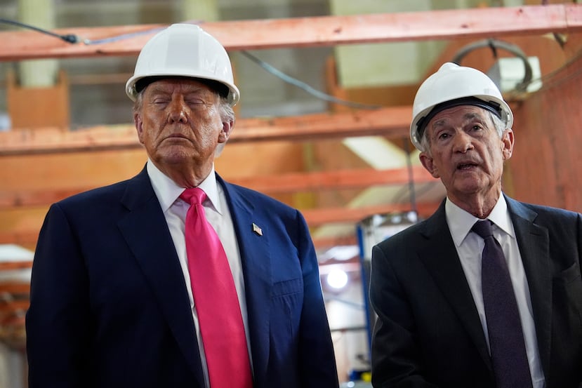 FILE - President Donald Trump listens as Federal Reserve Chairman Jerome Powell speaks during a visit to the Federal Reserve, July 24, 2025, in Washington. (AP Photo/Julia Demaree Nikhinson, File)