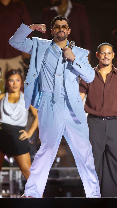 The blue suit Benito wore to open his concerts was custom-made by Anthony Vaccarello for Saint Laurent.