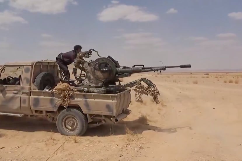 This image taken from undated video released by the Ansar Allah Media Office, the media arm of Yemen's Houthi rebels, on Wednesday, Sept. 9, 2026, shows a Houthi fighter firing a truck-mounted anti-aircraft gun during what the group said was an attack on Saudi-backed forces in eastern Jawf province, Yemen. (Ansar Allah Media Office via AP)