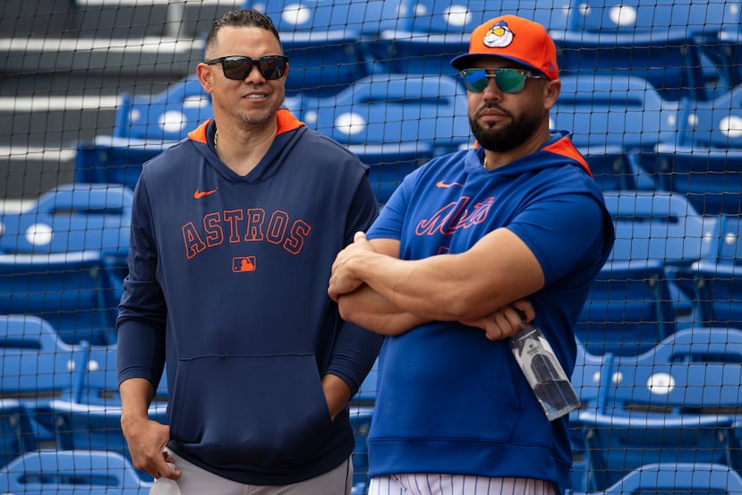 Alex Cintrón, a la izquierda, junto a Carlos Beltrán.