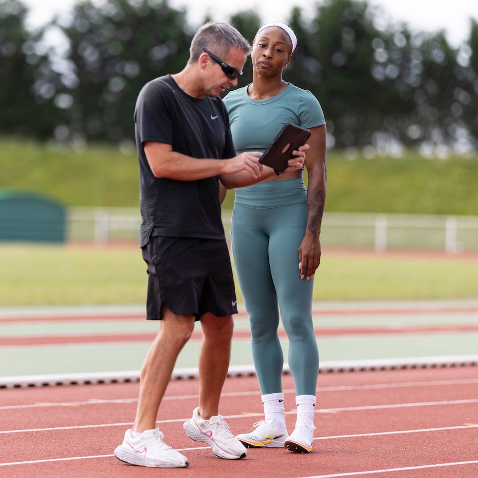 Irish coach John Coghlan, here with Jasmine Camacho-Quinn, is a proven professional in the 100-meter hurdles.
