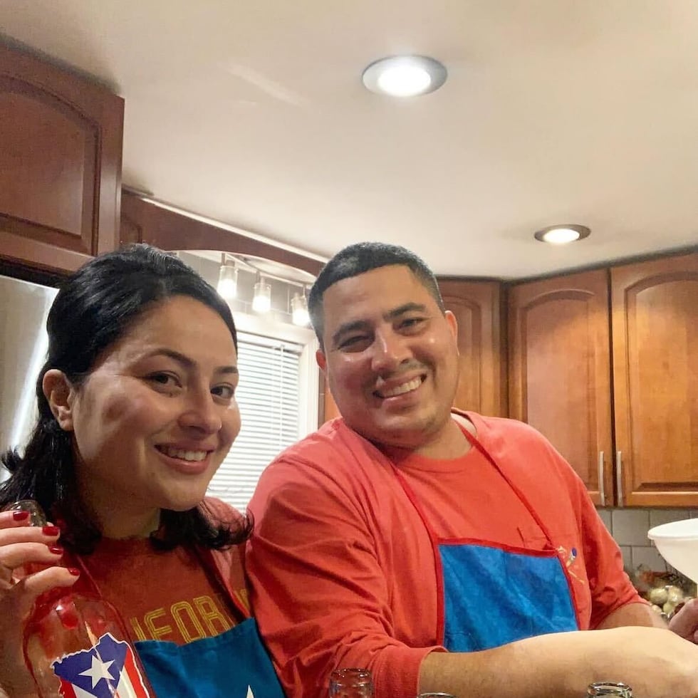 Kayla Lalles Silva (with her father, Hugo Lalles Figueroa) in the middle of making coquito.