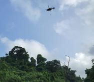 Helicóptero de FURA transporta el cuerpo de uno de los hermanos fallecidos en el área del charco El Hippie en Naguabo.