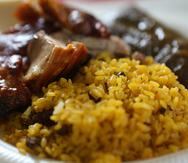 El arroz es uno de los alimentos más consumidos en la isla. Aquí, uno de los platos preferidos por los boricuas: arroz con gandules con pernil y pastel.