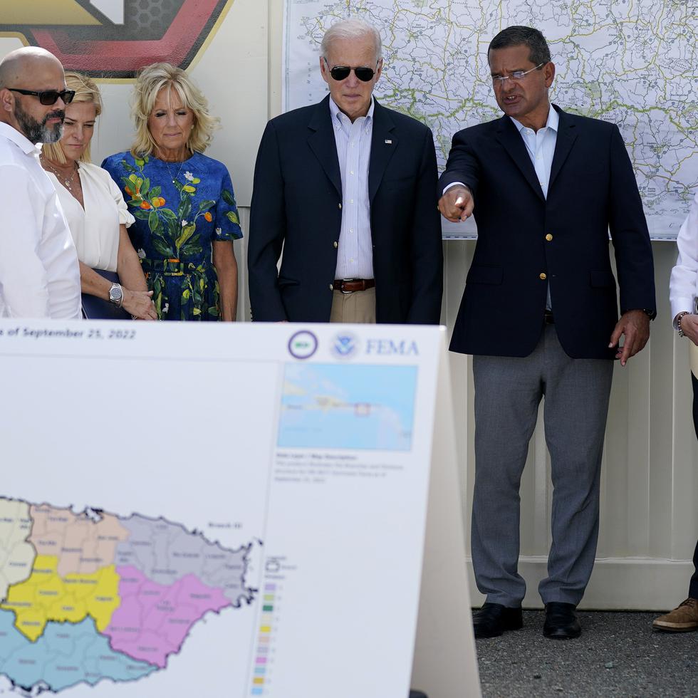 President Joe Biden and first lady Jill Biden, receive a briefing from Puerto Rico Gov. Pedro Pierluisi on Hurricane Fiona, Monday, Oct. 3, 2022, in Ponce, Puerto Rico. (AP Photo/Evan Vucci)