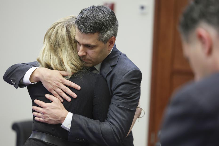 Actress Amber Heard hugs her attorney Benjamin Rottenborn after the verdict was read, where the jury awarded her $2 million, after the jury found Depp liable on one of three counts of defamation in Heard's countersuit.