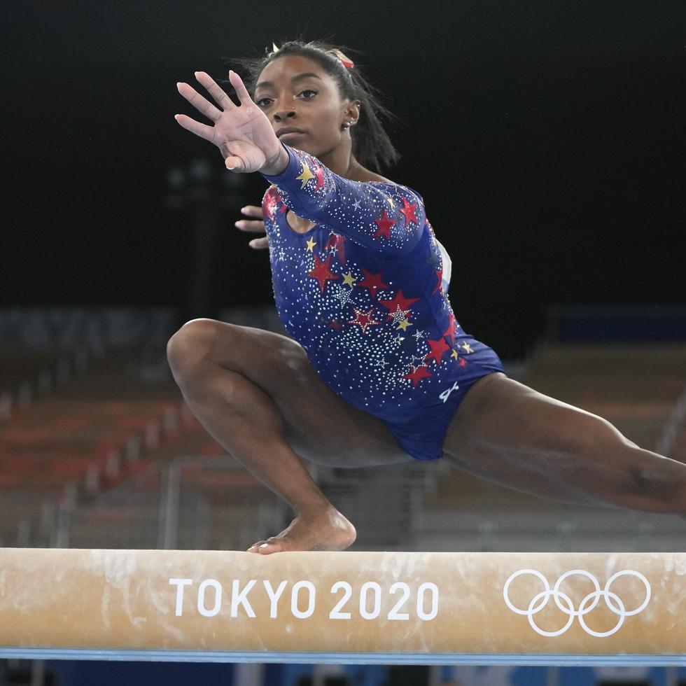 Simone Biles, of the United States, performs on the balance beam during the women's artistic gymnastic qualifications at the 2020 Summer Olympics, Sunday, July 25, 2021, in Tokyo. (AP Photo/Natacha Pisarenko)