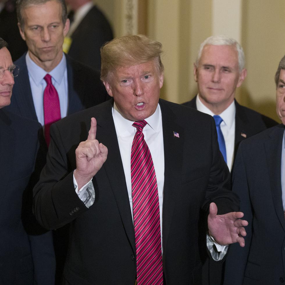 FILE - In this Wednesday, Jan. 9, 2019 file photo, Sen. John Barrasso, R-Wyo., left, and Sen. John Thune, R-S.D., stand with President Donald Trump, Vice President Mike Pence, Sen. Roy Blunt, R-Mo., and Senate Majority Leader Mitch McConnell of Ky., as Trump speaks while departing after a Senate Republican Policy luncheon, on Capitol Hill in Washington. The Republican Party still belongs to Donald Trump. The GOP privately flirted with purging the norm-shattering former president after he incited a deadly riot at the U.S. Capitol last month. But in the end, only seven of 50 Senate Republicans voted to convict Trump in his historic second impeachment trial on Saturday, Feb. 13, 2021. (AP Photo/Alex Brandon, File)
