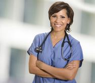 young female healthcare professional photographed hospital background.
