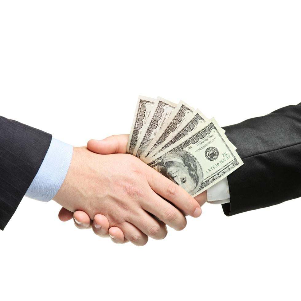 Handshake with money